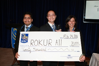 2010/11 winning team, ROKUR AII (University of Waterloo), accept their prize, a cheque for $20,000.