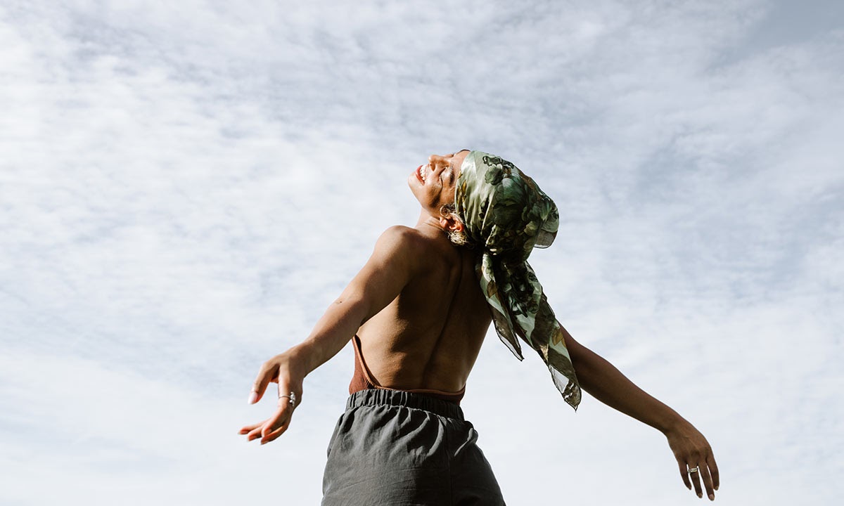 Woman with arms open to the sky