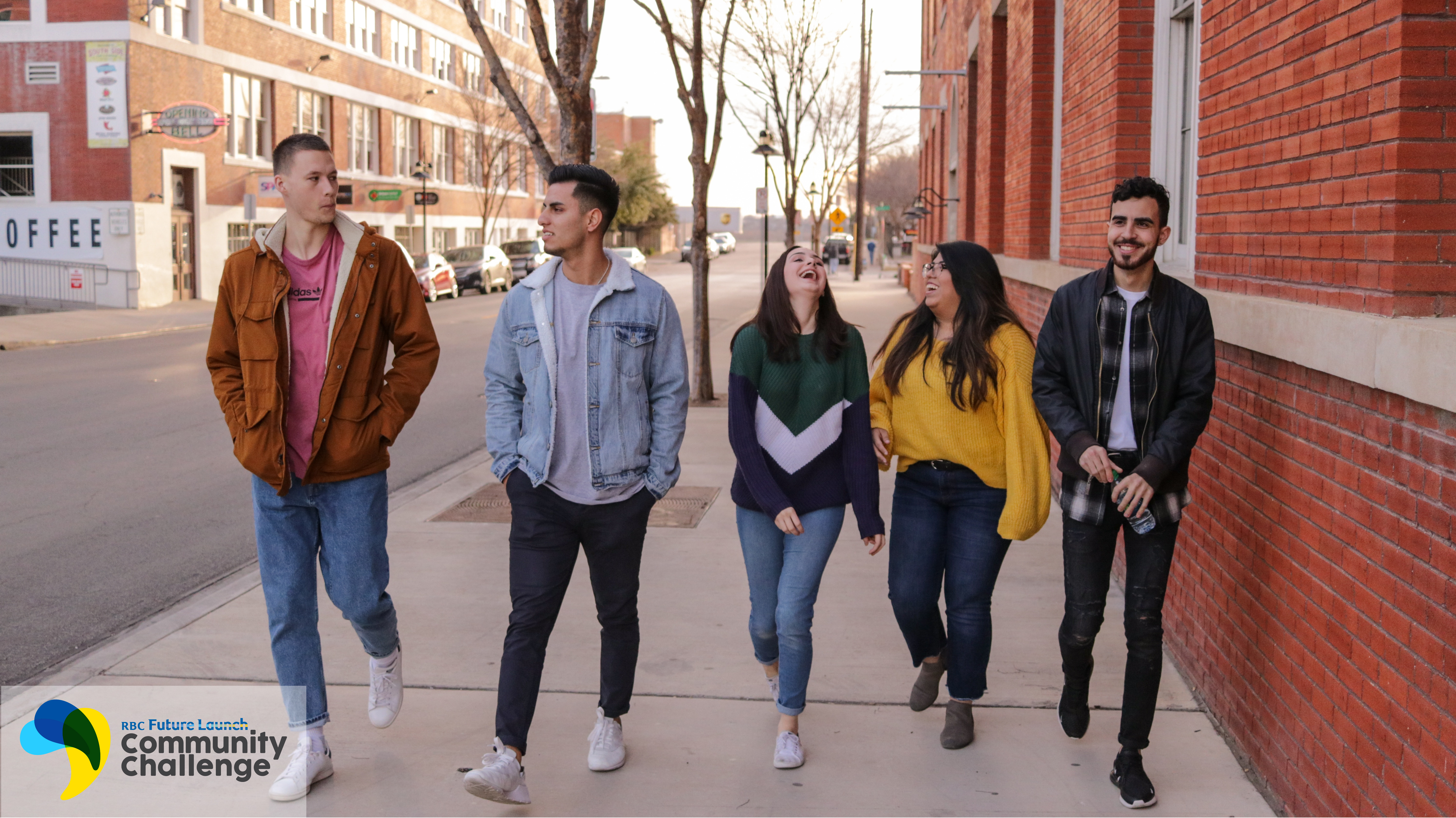 5 students walking on a sidewalk