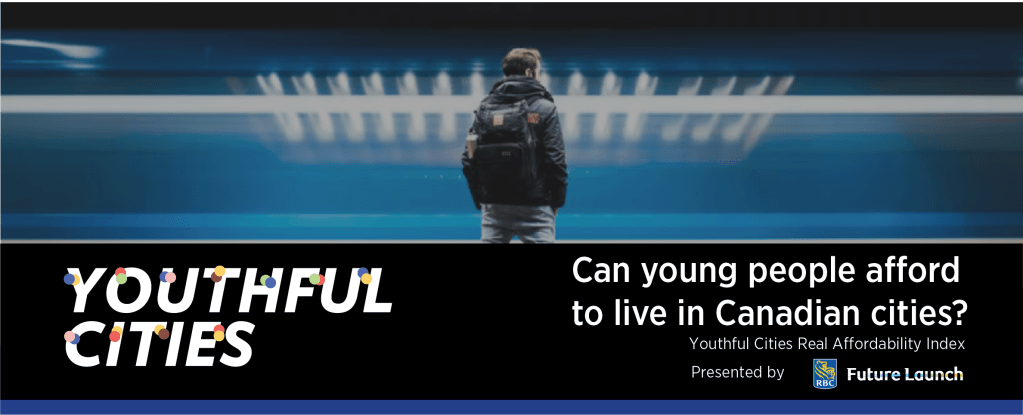 A young man waiting for a train on a subway station.