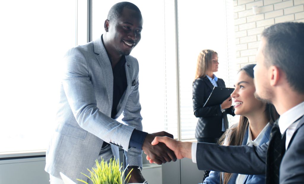 An interviewee shaking hand with interviewer.