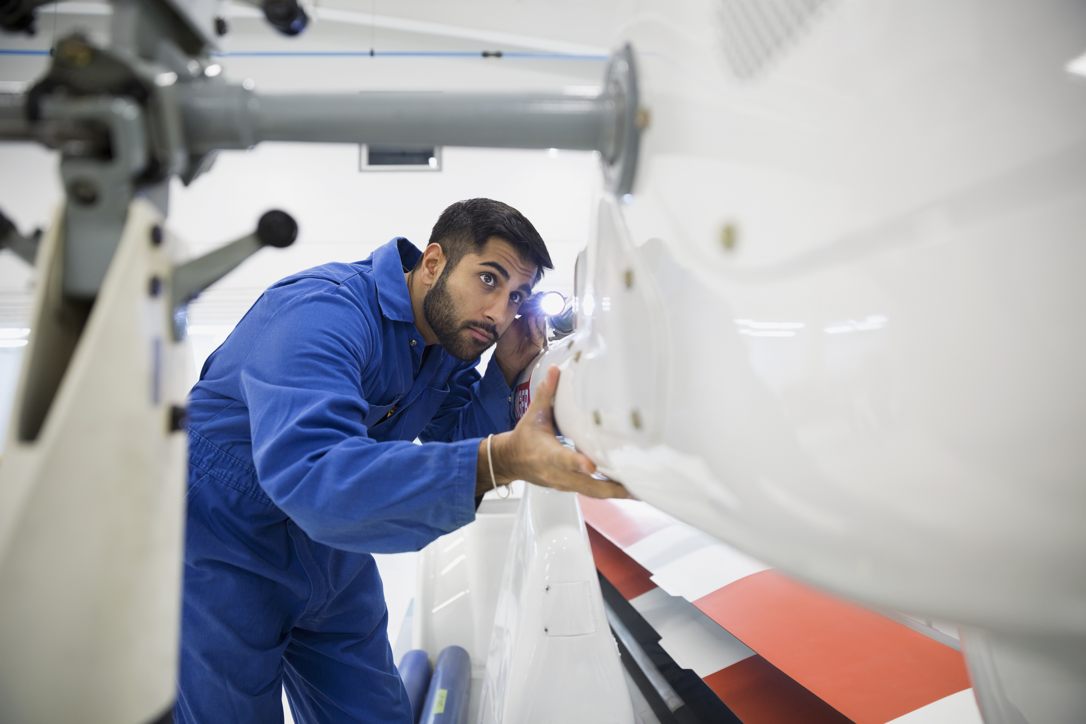 Helicopter mechanic examining panel